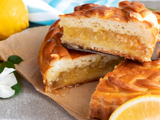 Yummy freshly delicious homemade pie cake with lemon filling cut, close up