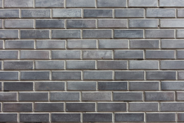 Grey brick background. For the presentation of something serious and significant. Modern backgrounds.