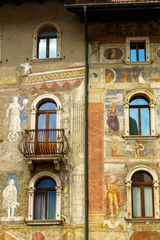 Trento, Italy: painted facade of historic buildings in the cathedral square