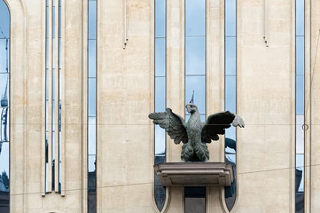 Big eagle sculpture on the facade of an building in Tbilisi Georgia