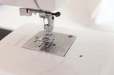 Sewing machine element on a white background. For the presentation of handwork and care of production. delicate production