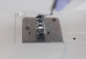 Sewing machine element on a white background. For the presentation of handwork and care of production. delicate production