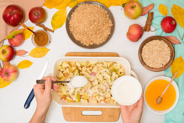Apple crisp crumble, step-by-step recipe and mixing ingredients for home cooking on a light background top view. traditional autumn dessert with cinnamon and oatmeal, honey