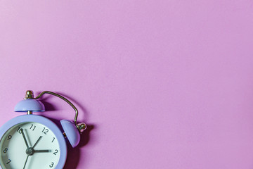 Simply minimal design ringing twin bell vintage classic alarm clock Isolated on purple violet...