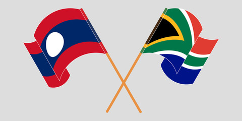 Crossed and waving flags of Laos and Republic of South Africa