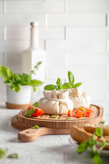 
burrata cheese with fresh tomatoes and basil