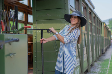 Portrait of young woman at railroad station