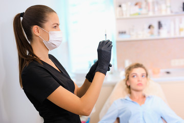 Client with shock emotion when beautician preparing injection in syringe