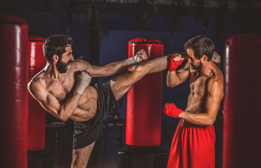 Fototapeta na wymiar Fight between two kickboxers, or thaiboxe