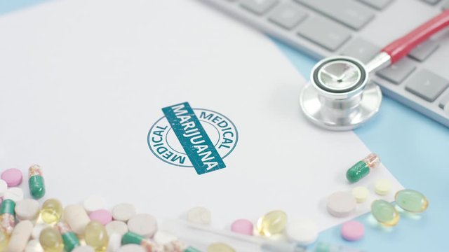 MEDICAL MARIJUANA rubber stamp on the paper