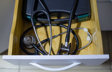 stethoscope in a cabinet drawer