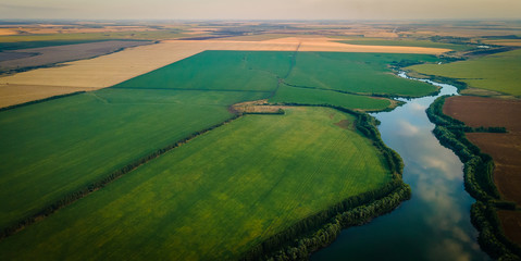 the lake in the middle of endless green fields