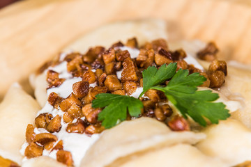 Traditional Slovak food - Bryndzove pyrohy with bacon on plate. The food in the restaurant. Food styling and restaurant meal serving.