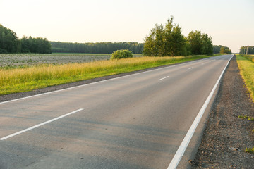 empty country road at sunset