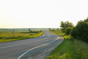 Fototapeta premium empty country road at sunset
