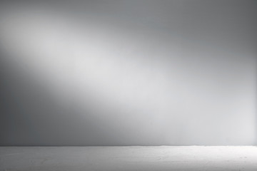 Cement background with beam of light. Background for product presentation.