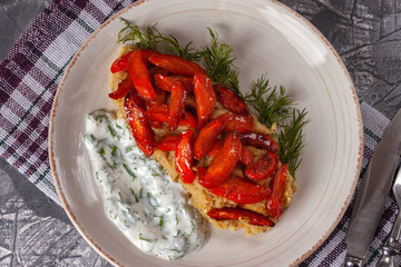 Caramelized carrots garnished with lentils and yogurt-based sauce