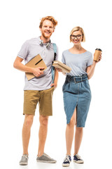 Fototapeta premium Students with books and disposable cup looking at camera on white background