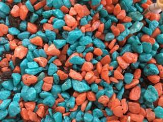 Texture of colored blue and red stones. filler for flowers and plants