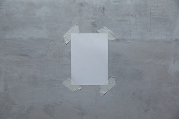 a sheet of paper with mock up taped to the wall