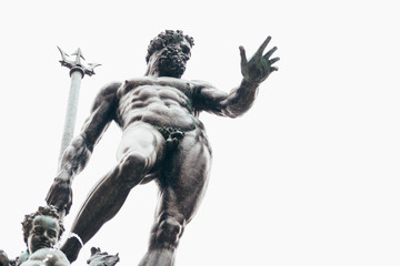 Neptune statue. Piazza del Nettuno square in Bologna, Italy. font detail.