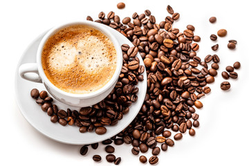 Coffee in a white cup with a saucer and coffee grains on a white background. Isolate