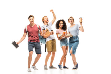 Obraz premium Multiethnic students with books and coffee to go on white background
