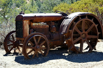 Fototapeta premium Old rusty tractor and wheels