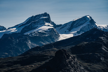 View of famous alpine 4000 m peaks Rimpfischhorn and Strahlhorn, Zermatt, Saas Fee, Switzerland.