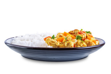 Curry chicken with rice in a plate on a white isolated background