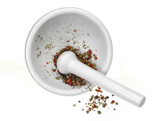 Spice of red pepper. Spices and herbs. Ceramic mortar and pestle with mixed spices on rustic wooden board. Pepper, dried rosemary, garlic, laurel...