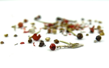  Dry rosemary and multicolored pepper. Mixed spices isolated on white background.
