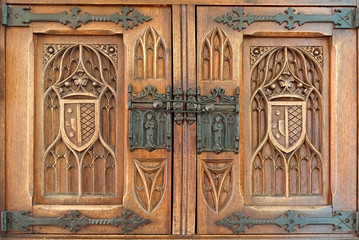 Wooden fretted panels with coat of arms