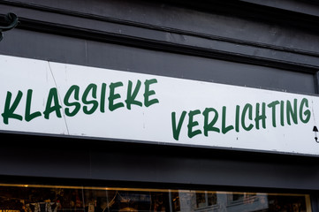 Obraz premium Lighting shop sign in Dutch, classical lighting