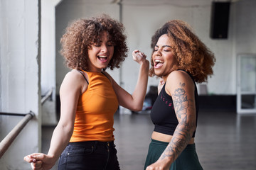 Happy pretty ladies having fun in studio