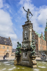 Fototapeta premium Neptune Fountain (1622) in Frederiksborg Castle (Frederiksborg Slot, XVII century). Hillerod, Denmark.