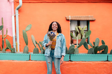 Happy teenager holding flowers