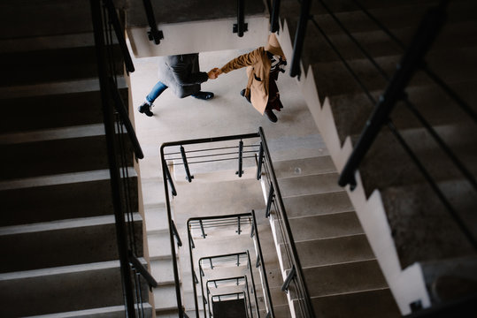 people quickly run up the stairs