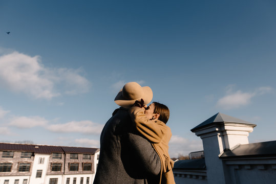 couple in love kissing on the roof