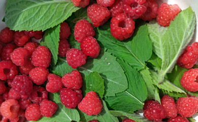 photo of raspberries and mint leaves. ingredients for mojito. Top view