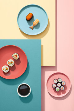 A set of sushi roll different type on colorful background