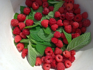 photo of raspberries and mint leaves. ingredients for mojito. Top view