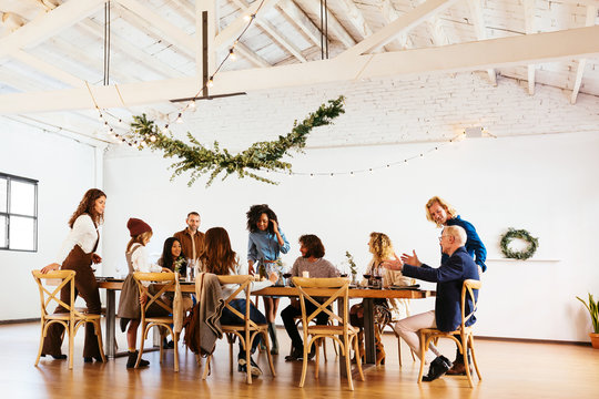 Friends and family gathering around table