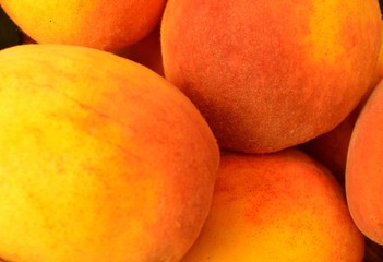 background of appetizing, natural, ripe, organic peaches