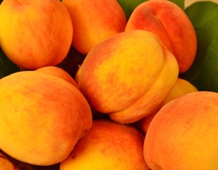 background of appetizing, natural, ripe, organic peaches