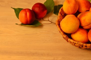 ripe nectarine and peaches on a wooden table