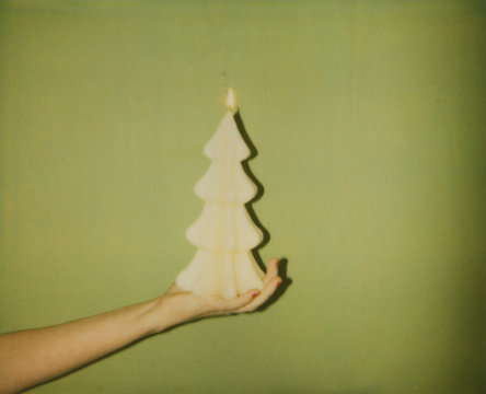 Old Polaroid photo of Christmas tree shaped candle