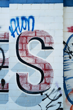 The letter S painted on wall
