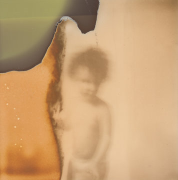 Old Expired Polaroid photo of a kid