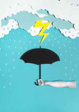 Umbrella under the storm with lighting bolt